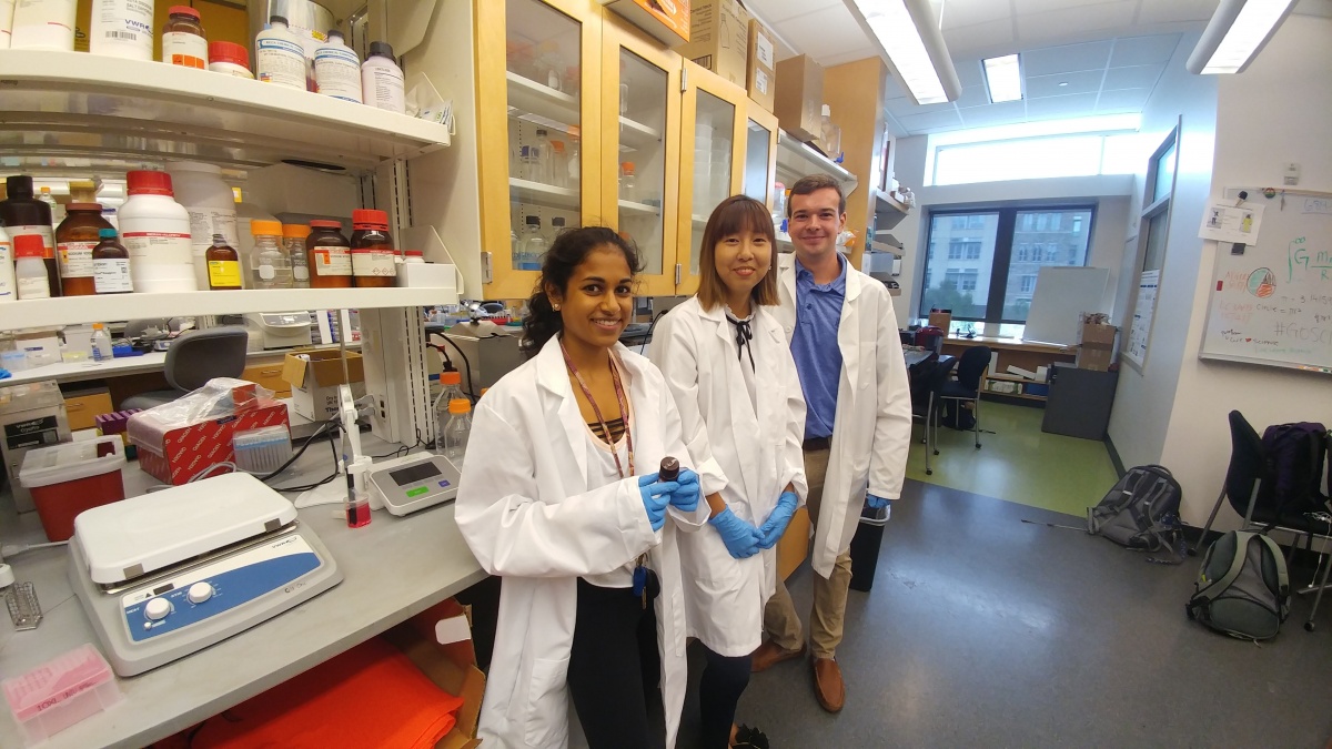 three people in a lab