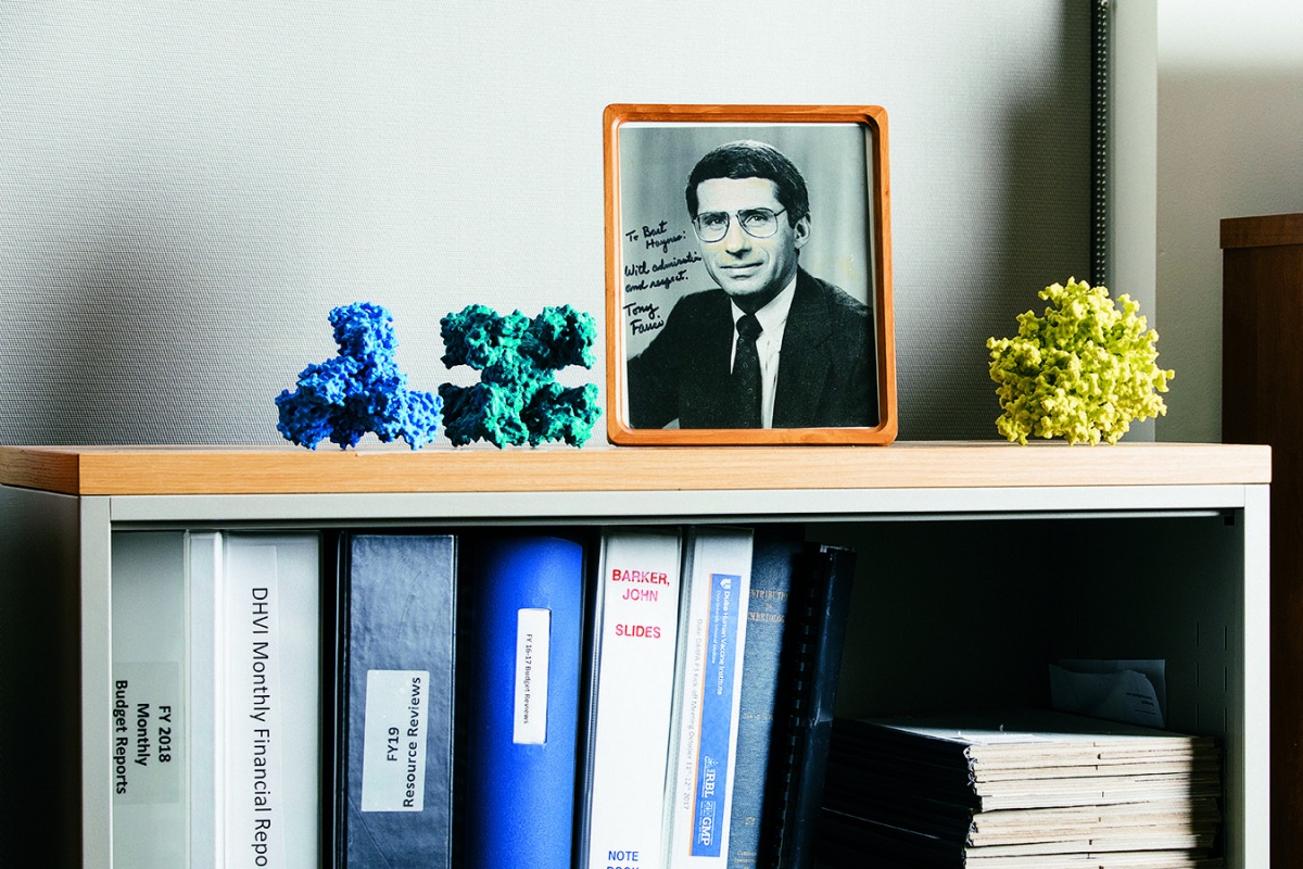 book shelf with signed photo of Anthony FAuci