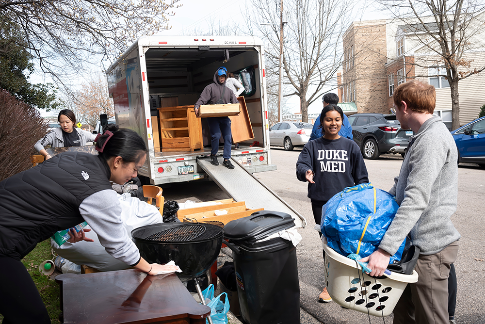 Student volunteers unloading a uhaul