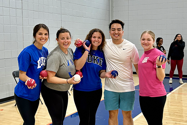 five duke students posing with boccia balls