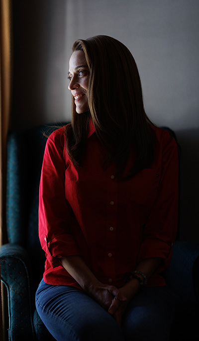 Talia Aaron, MD sitting in her home