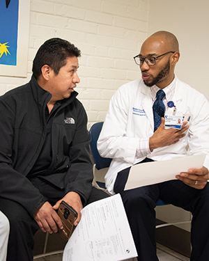 medical student talking to patient