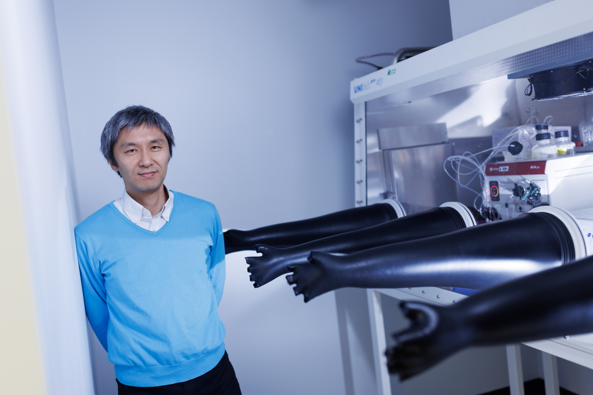 Ken Yokoyama standing in his lab